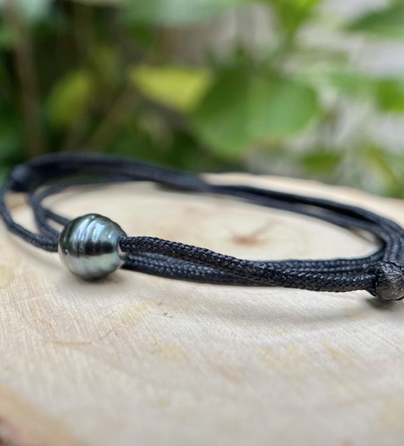 Joya en perla de Tahití con reflejos raros y brillo excepcional. Certificado de autenticidad y entrega segura – Poemotu.