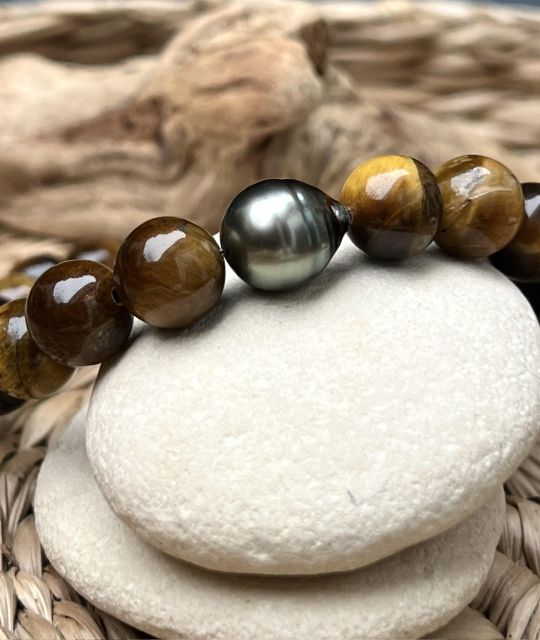 Découvrez cet exemplaire unique, un bracelet en perles d'oeil de Tigre et sa vraie perle de Tahiti certifiée et garantie - taille 19/21cm - livraison gratuite