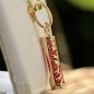 Kraft – Tiki – Gelbvergoldet – Korallenfarbe Kraft – Tiki – Gelbvergoldet – Korallenfarbe